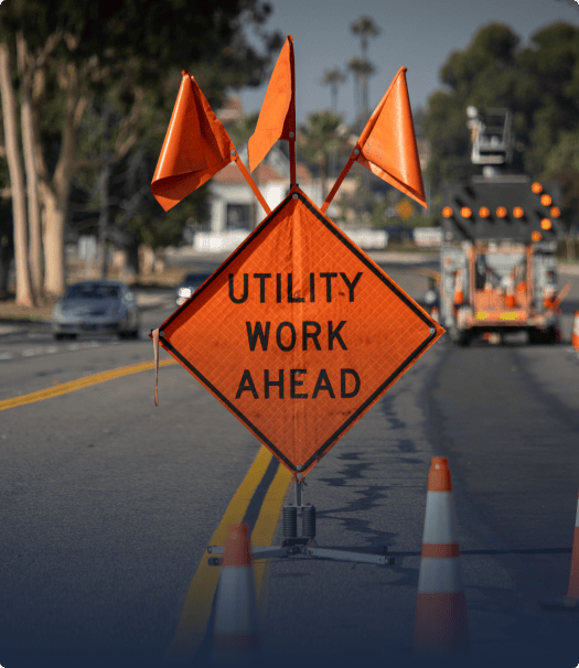 Orange utility work ahead sign