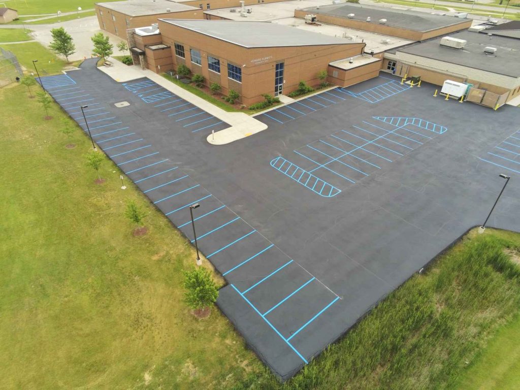 aerial view of parking lot with blue parking lot stripes