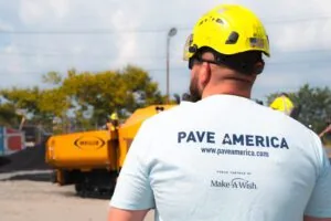 back of a pave america employee wearing a pave america/make-a-wish partnership t-shirt