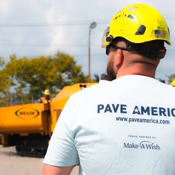 back of a pave america employee wearing a pave america/make-a-wish partnership t-shirt