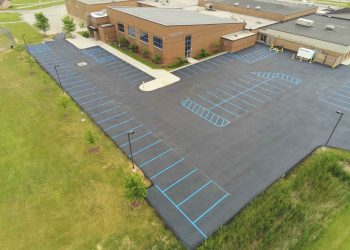 aerial view of parking lot with blue parking lot stripes