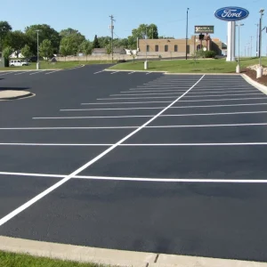 white parking lot spots for a ford dealership