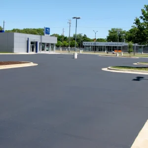 asphalt parking lot of a car dealership