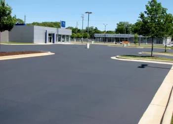 asphalt parking lot of a car dealership