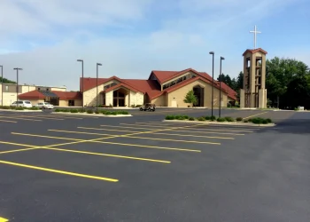 yellow parking lot spots in front of a church