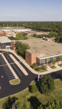 Educational-Facilities-2 aerial view of a school and parking lot