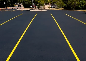 freshly painted yellow parking space lines