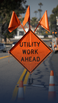 Orange utility work ahead sign Orange utility work ahead sign
